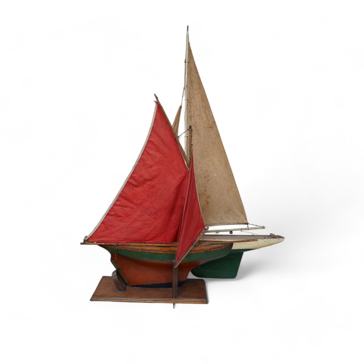 Two pond yachts, one on stand, largest 106 cm high. Condition - sails stained and paintwork chipped in places